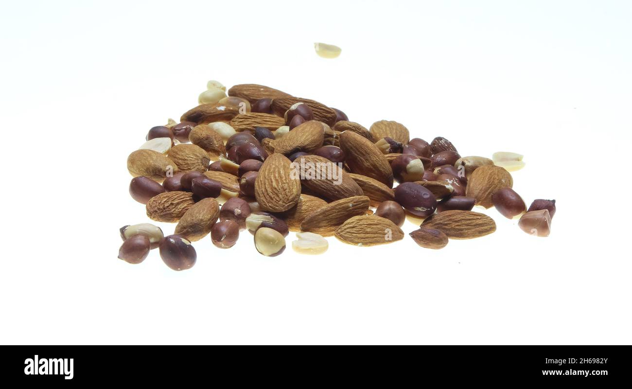 Almond mixed isolated on a white background close up shot.Almond isolated background with enough copy space for text. Stock Photo