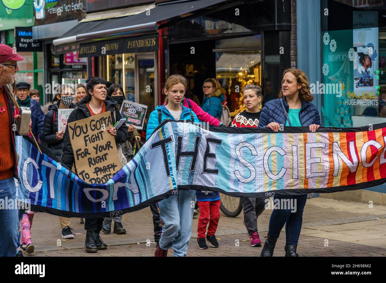 Harrogate Extinction Rebellion activists march through the town with banners and slogans to raise awareness about global warming, England, UK. Stock Photo