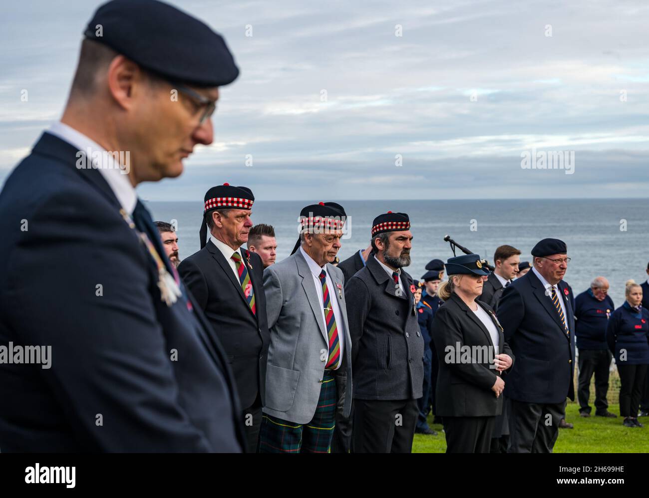 Dunbar, East Lothian, Scotland, United Kingdom, 14th November 2021. Remembrance Day: a commemorative service at the war memorial for a commemorative service. Pictured: veterans at the ceremony Stock Photo