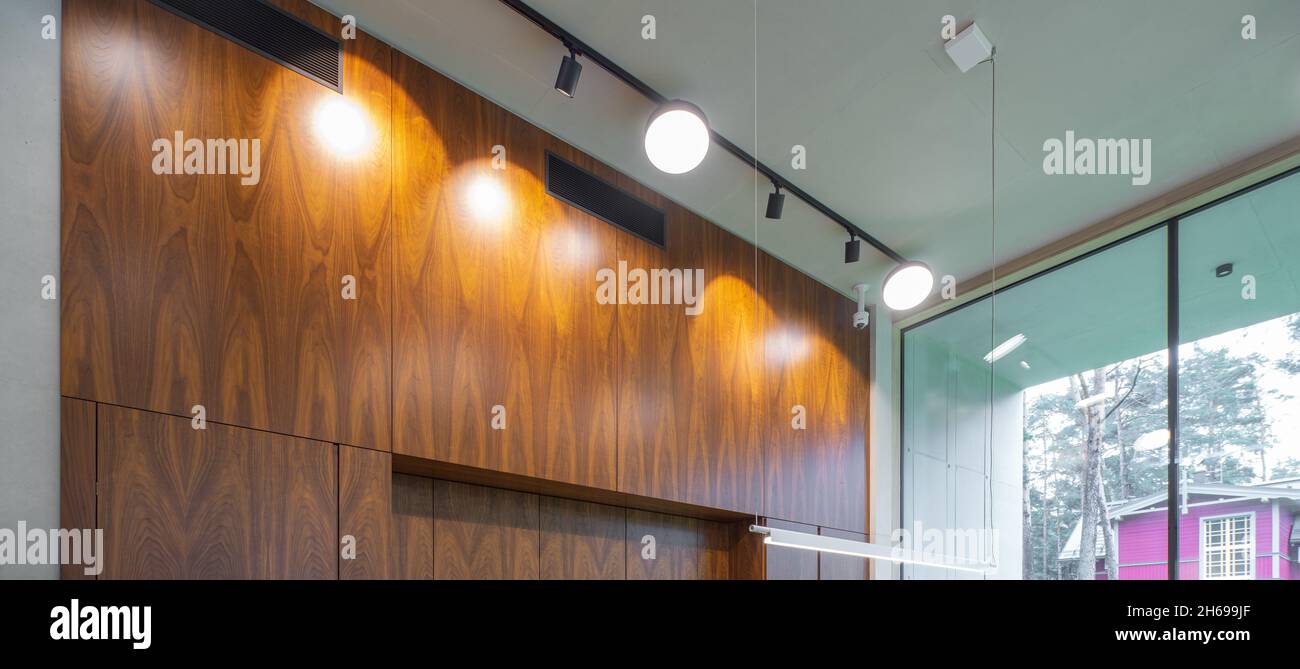 Modern interior of wooden kitchen. Luxury apartment. Lights on Stock Photo Alamy