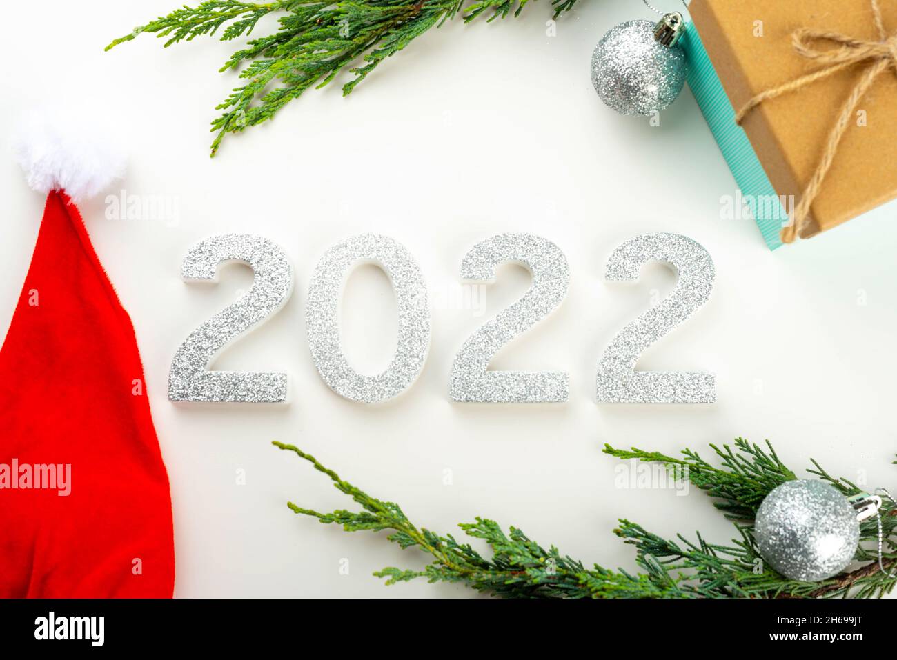 2022 Festive Greeting Background With Pine Cones, Silver Baubles, Christmas Tree Branches Stock Photo - Alamy