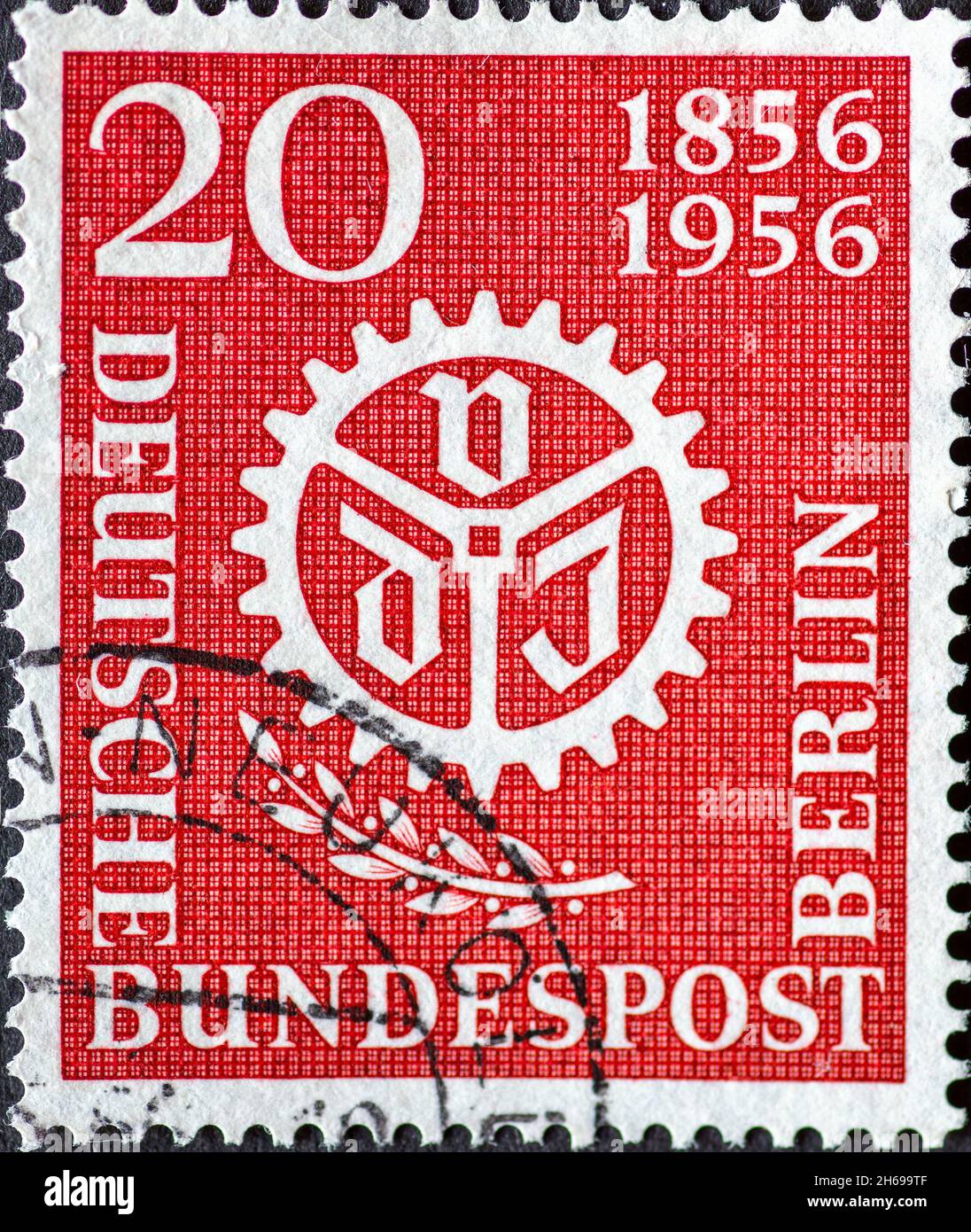 GERMANY, Berlin - CIRCA 1956: a postage stamp from Germany, Berlin showing VDI logo and a laurel branch. 100 years Association of German Engineers (VD Stock Photo