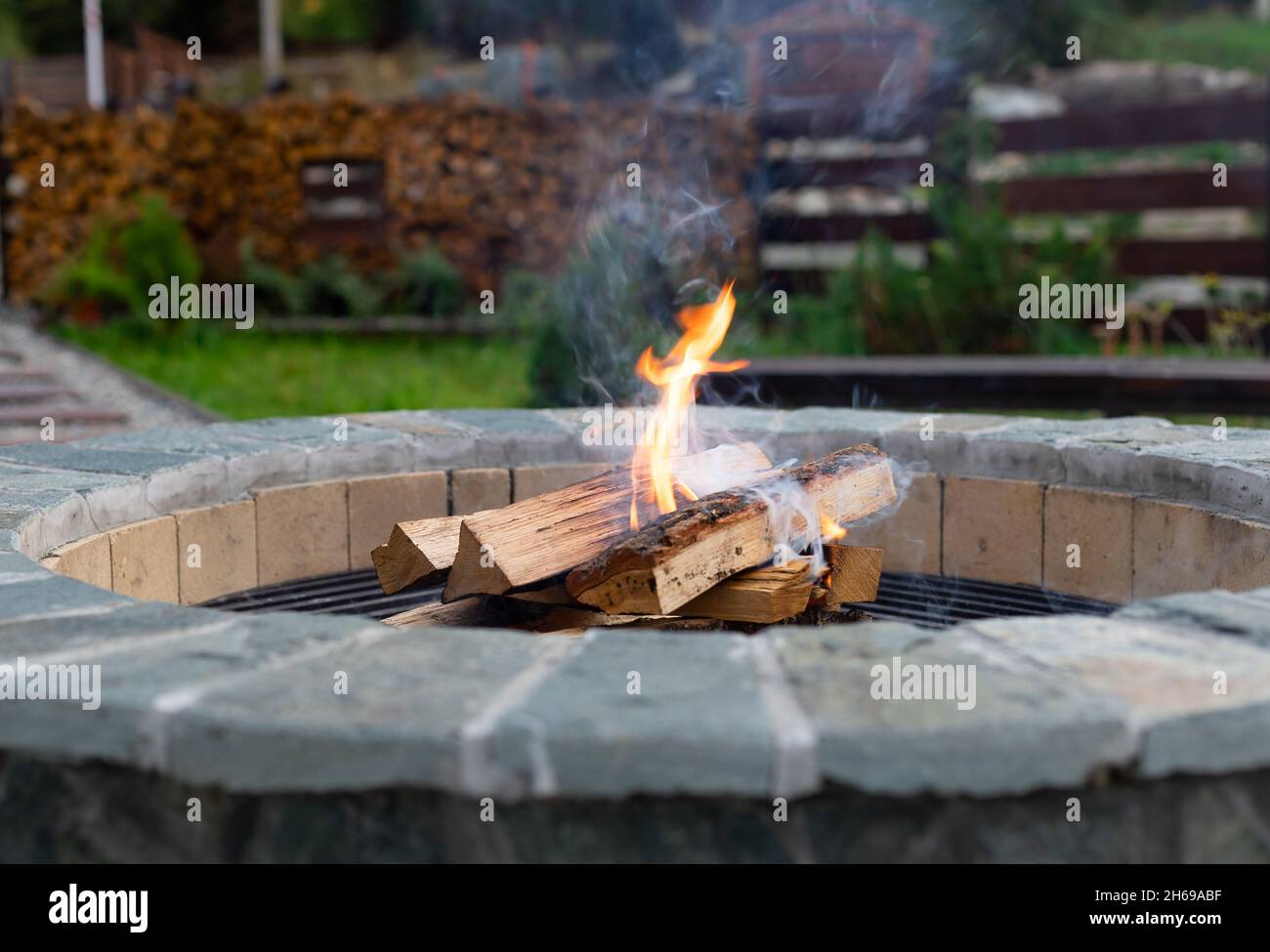 Zone for relax with burning fire pit, couch Stock Photo