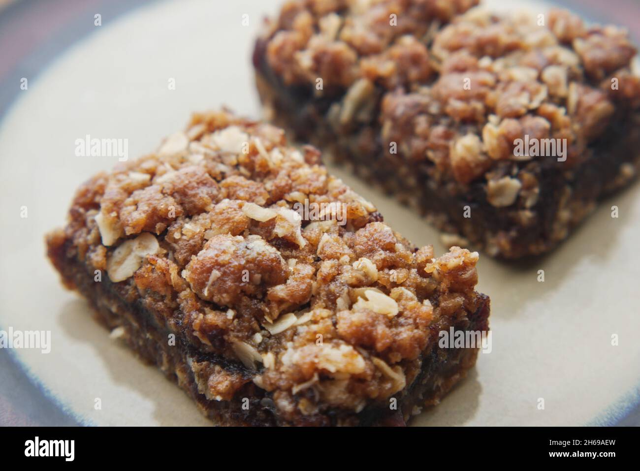 date fruit chocolate bar in a plate on table  Stock Photo