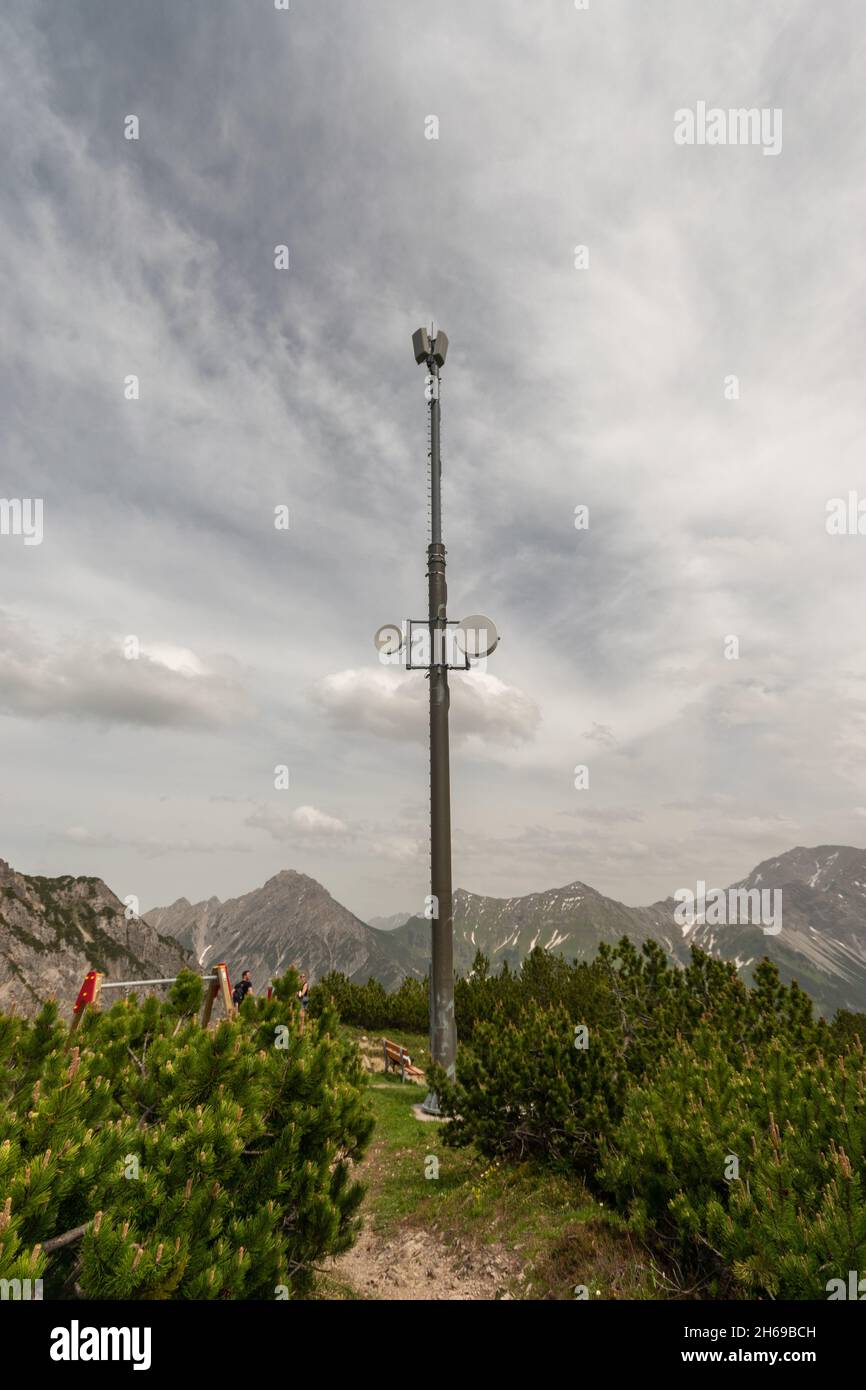 Sareis, Liechtenstein, June 20, 2021 Antenna on the peak in an alpine scenery with an overcast sky Stock Photo