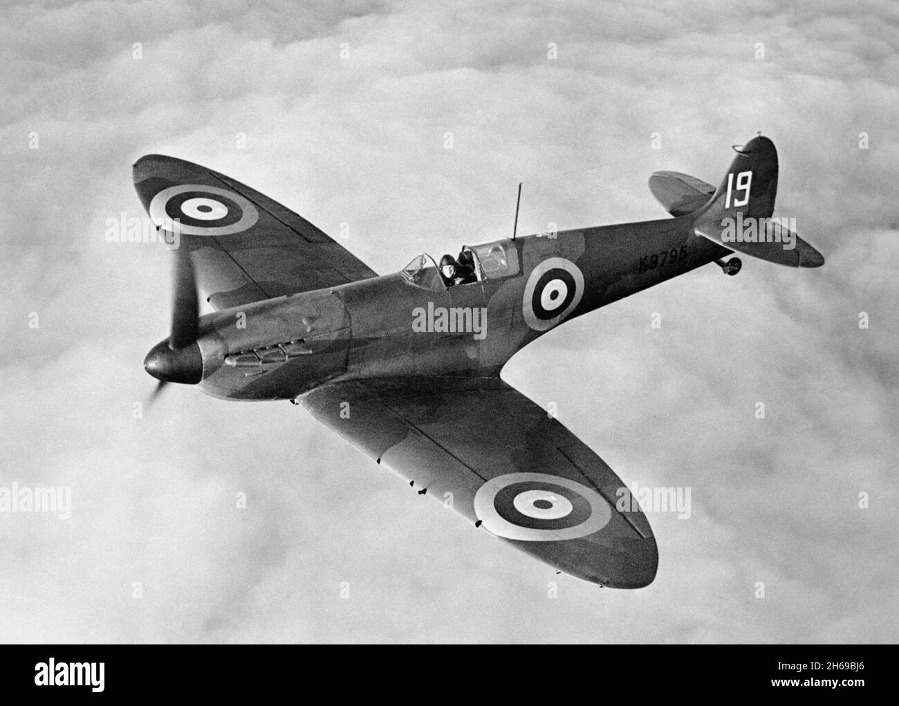 CAMBRIDGESHIRE, ENGLAND, UK - 1938 - A K9795 Supermarine Spitfire in flight over eastern England in 1938. The 9th production Mk I Supermarine Spitfire Stock Photo