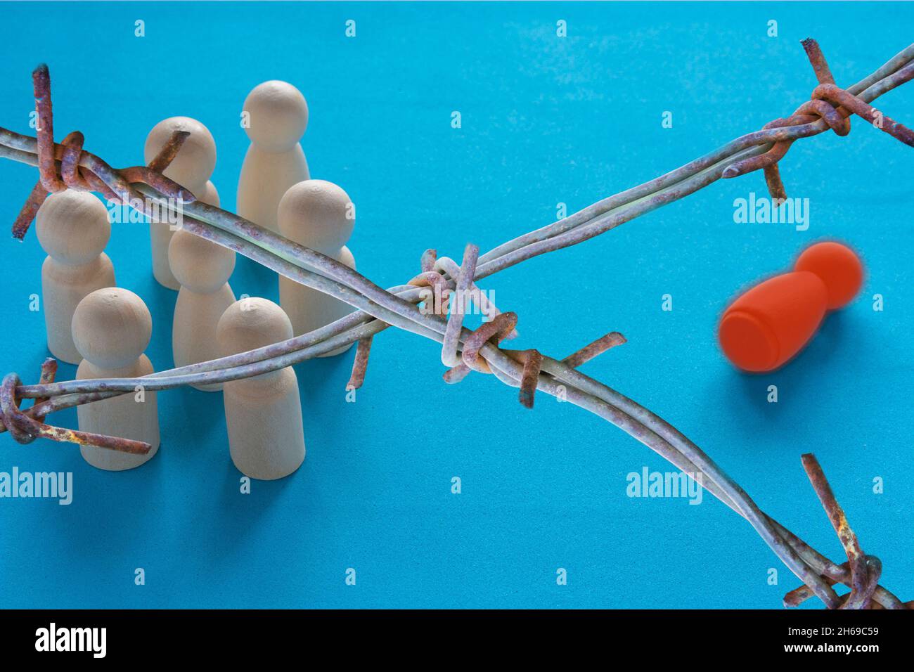 Refugees behind barbed wire camp inside buffer zone of the Belarus