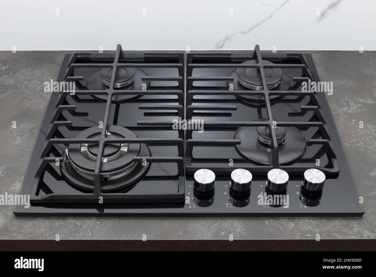 Modern gas stove top on dark countertop Stock Photo Alamy
