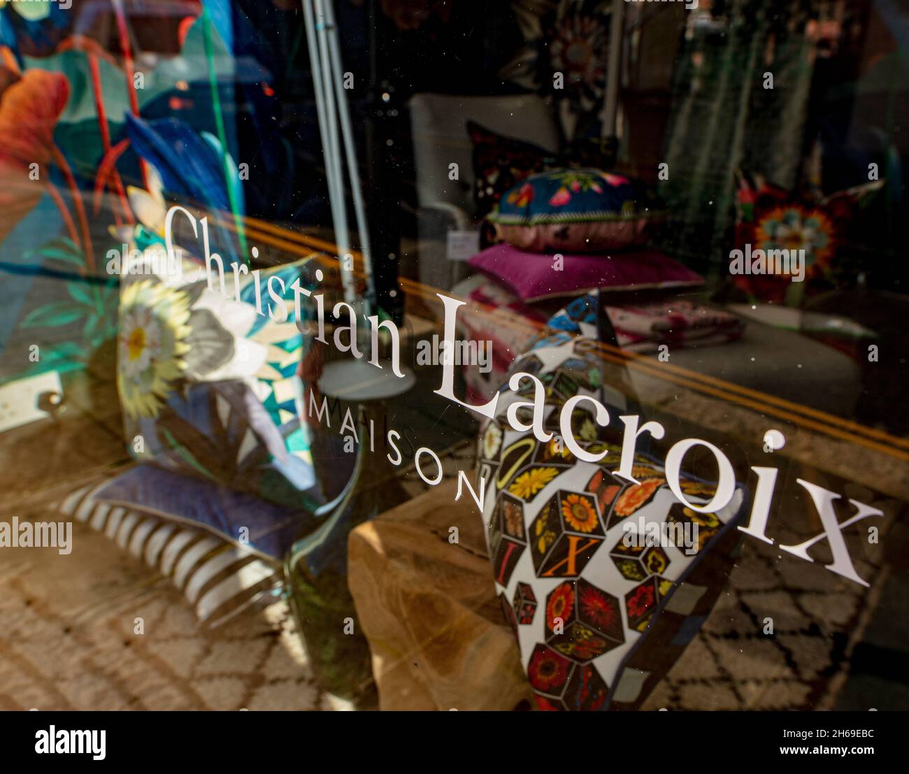 Window of interior furnishings store in Chelsea, London, showing Christian Lacroix logo Stock Photo