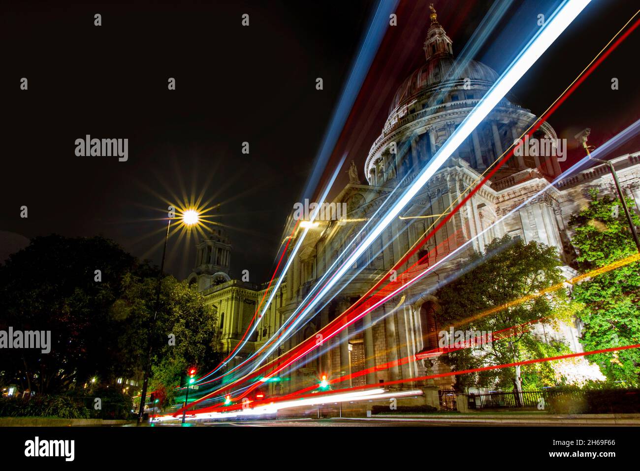ST PAUL'S CATHEDRAL AT NIGHT WITH BUS LIGHT TRAILS Stock Photo