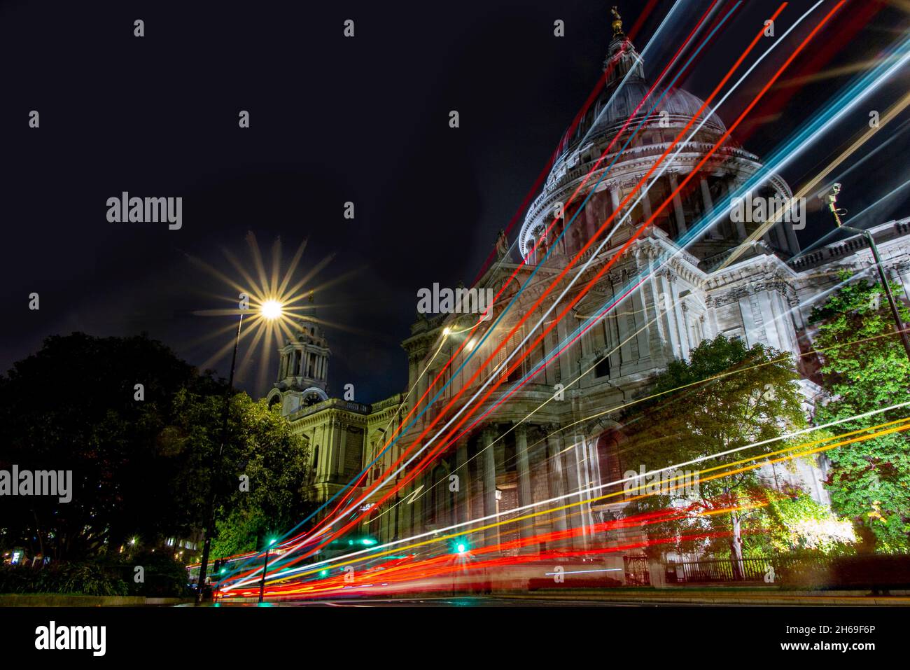 ST PAUL'S CATHEDRAL AT NIGHT WITH BUS LIGHT TRAILS Stock Photo