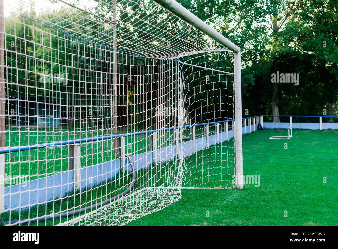 Training soccer field with a green turf. Football field with goals and