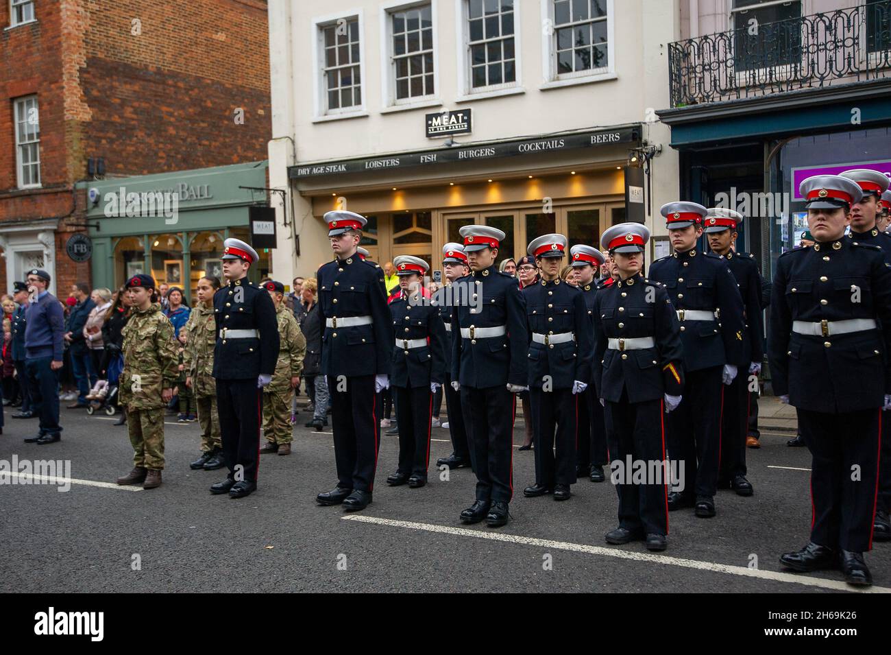 Windsor, Berkshire, UK. 14th November, 2021. There was a huge turnout for the Remembrance Sunday Service at the War Memorial, Windsor Parish Church this morning. Prayers were led by Revd Canon Sally Lodge and scripture read by the Mayor Of the Royal Borough of Windsor and Maidenhead, Councillor John Story. Windsor MP Adam Afriyie was also present together with RBWM Councillors, representatives from numerous local organisations and charities. Credit: Maureen McLean/Alamy Live News Stock Photo