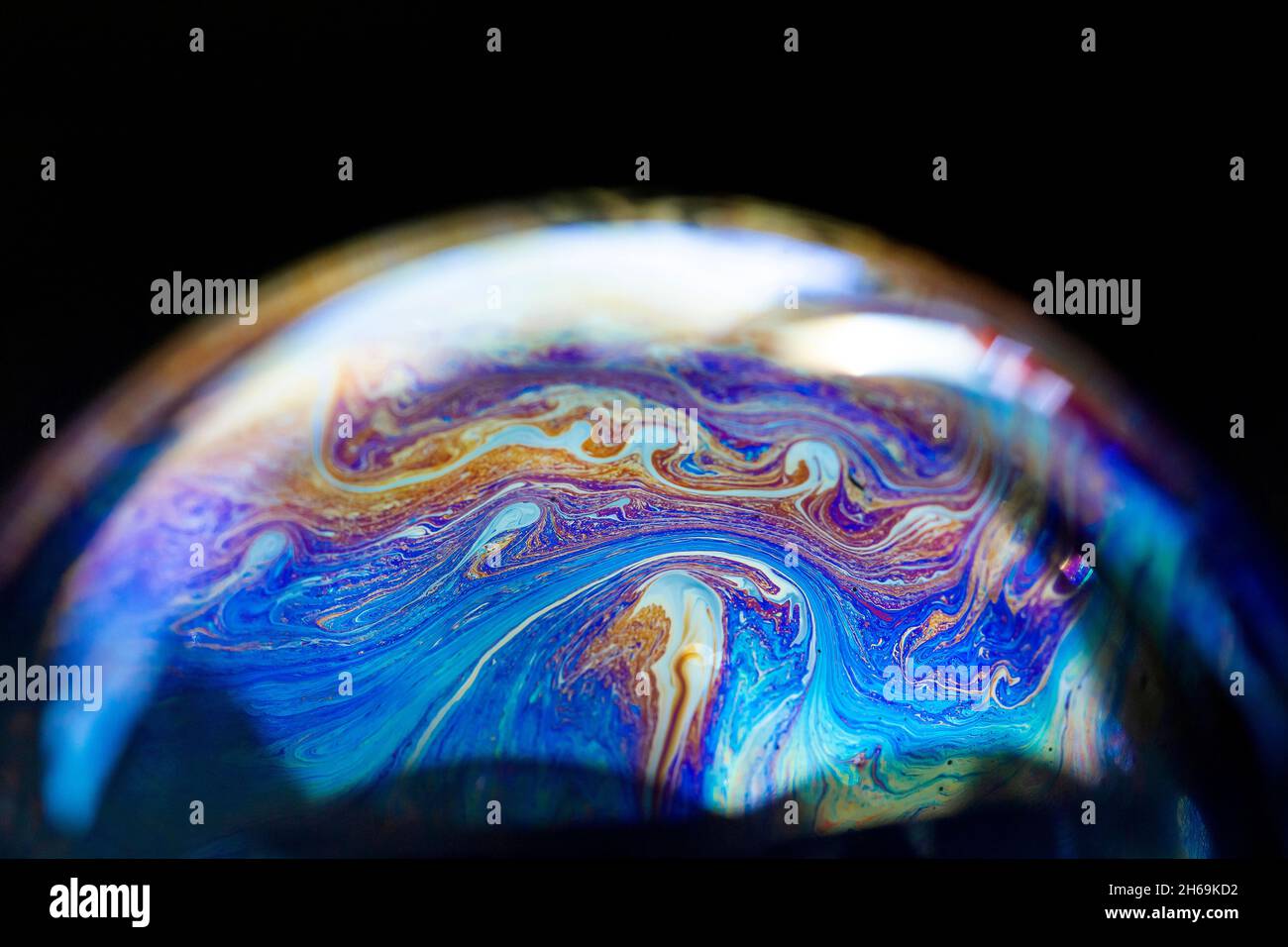 Abstract pattern, multicolored chaotic texture inside of the soap bubble, closeup Stock Photo