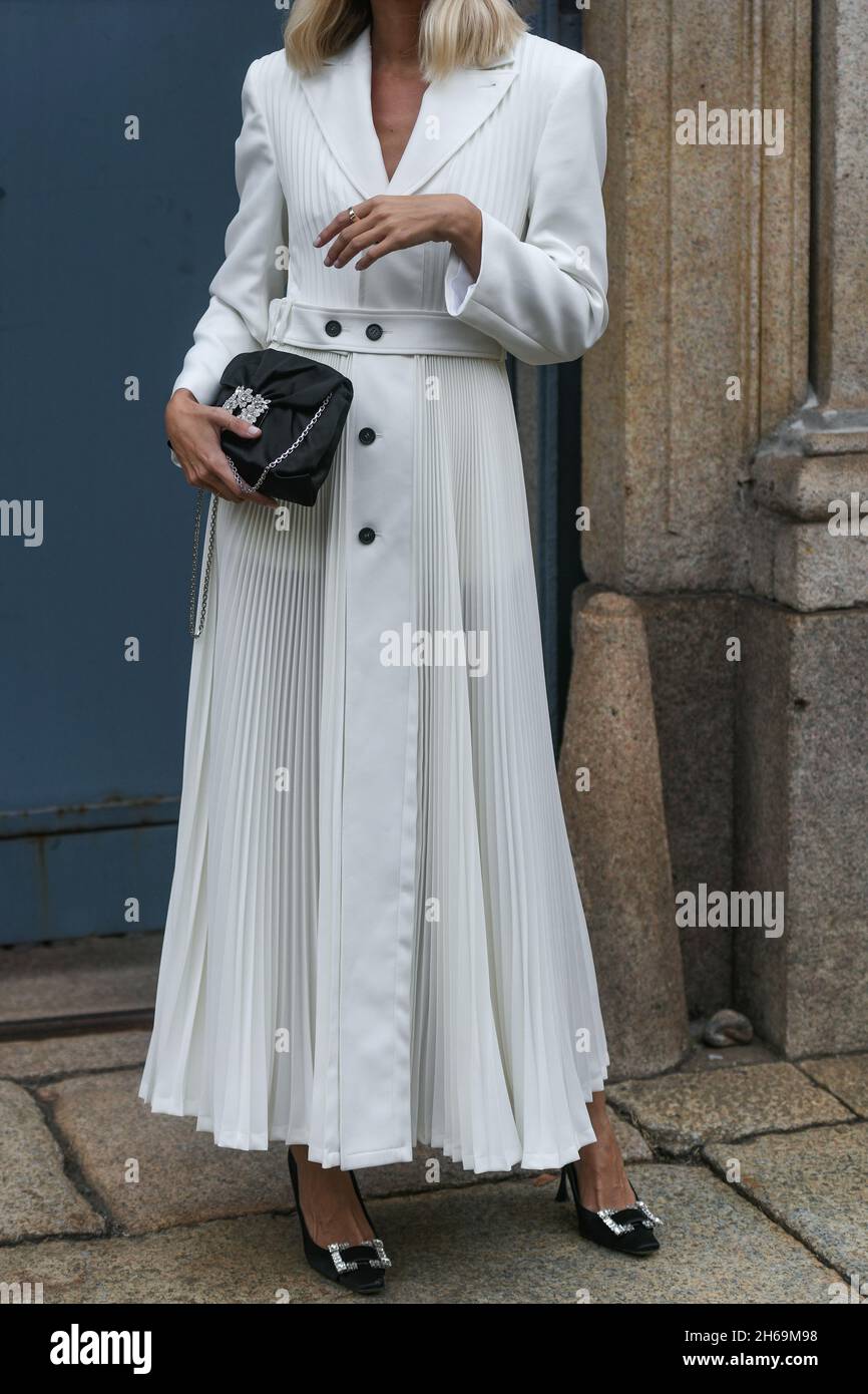 Milan, Italy - September 25, 2021:  Street style outfit, woman wearing a fashionable outfit on the streets of Milan, Italy. Stock Photo