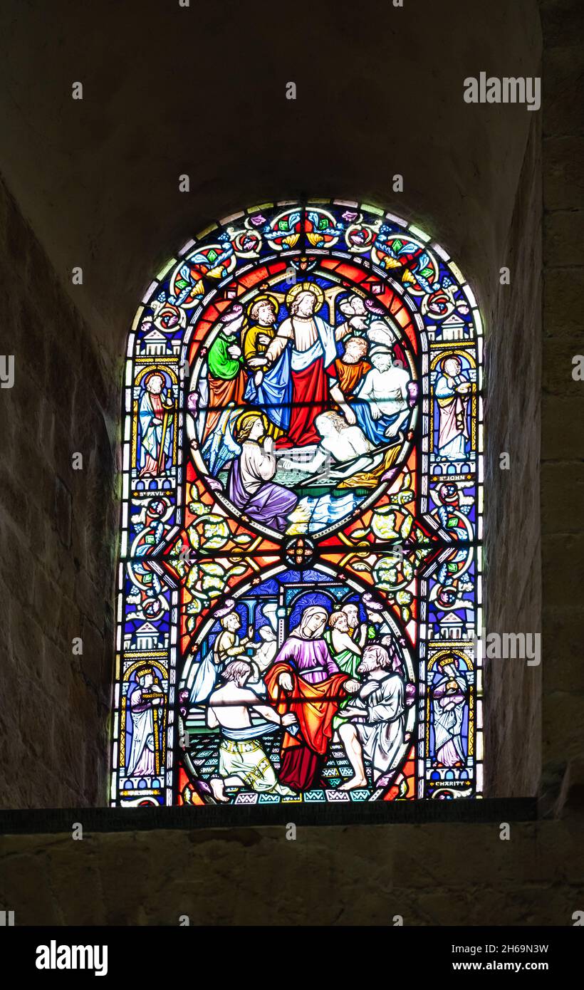 Stained glass window with 2 scenes in roundels in Baptistry of ...