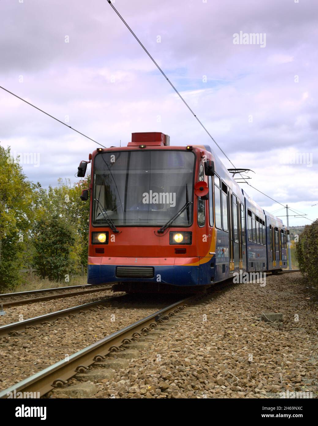 A tram travelling towards Crystal Peaks shopping centre, Sheffield, South Yorkshire Stock Photo