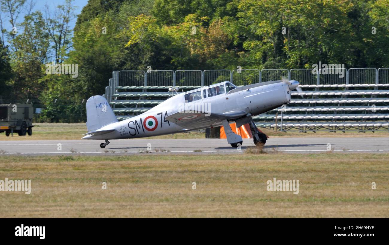 Rivolto del Friuli, Udine, Italy SEPTEMBER, 17, 2021 Metal grey military training vintage airplane with tailwheel undercarriage side view. Fiat G.46 Stock Photo