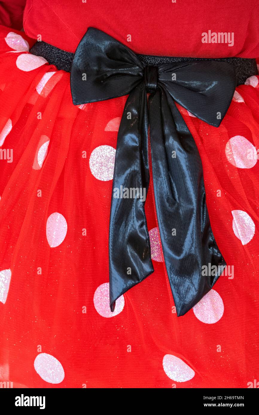Minnie Mouse costume red and white dress with black bow Stock Photo