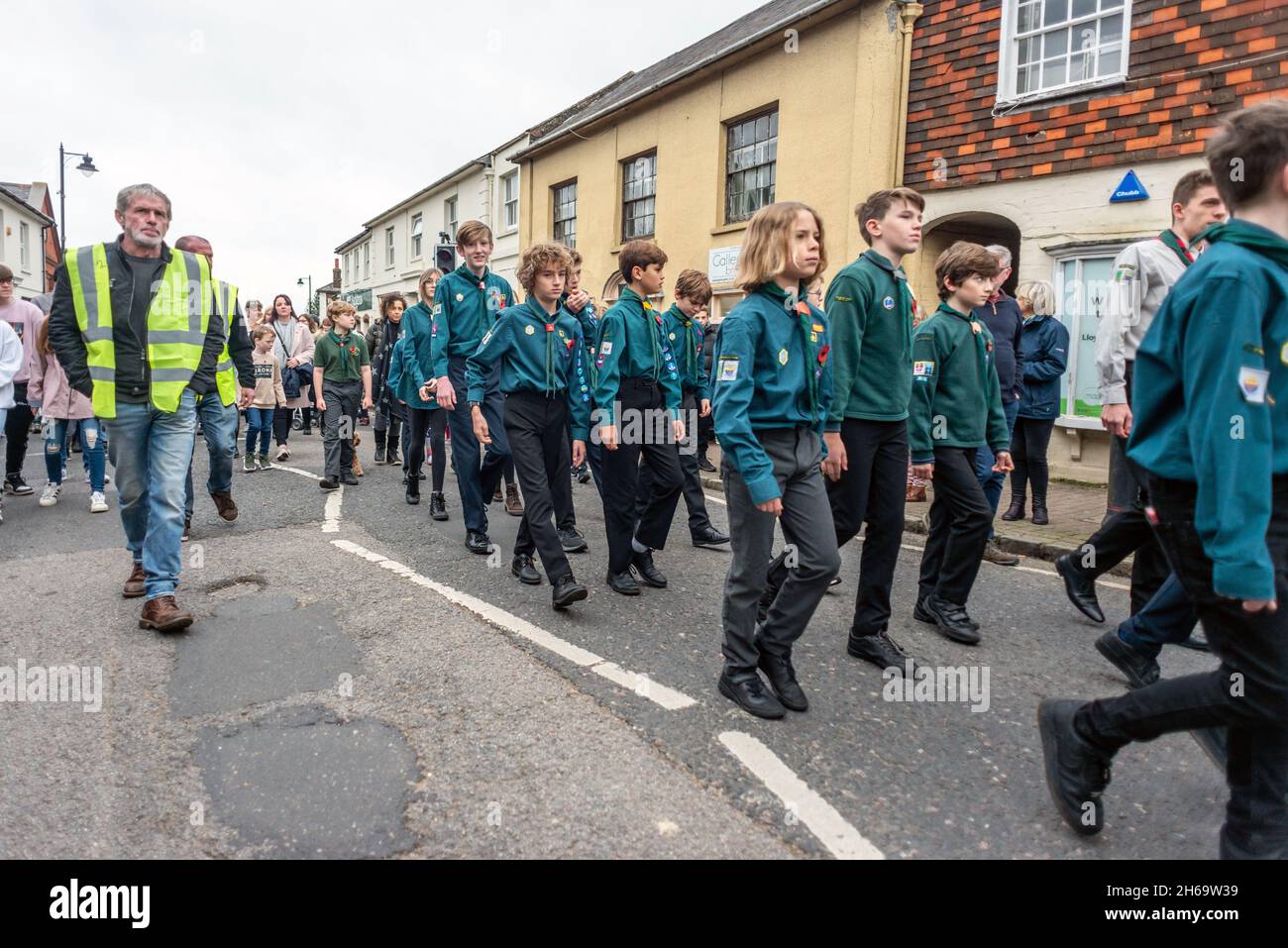 Henfield, Sussex, UK. 14th November 2021. The traditional Remembrance Sunday march through Henfield High Street in mid-Sussex Credit: Andrew Hasson/Alamy Live News Stock Photo