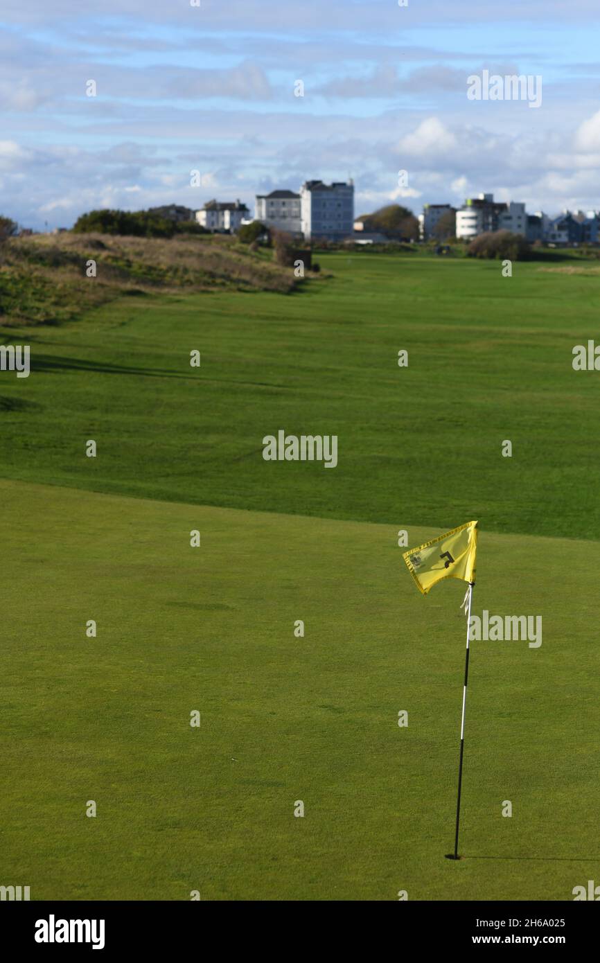 Placing the flag back in the hole hires stock photography and images