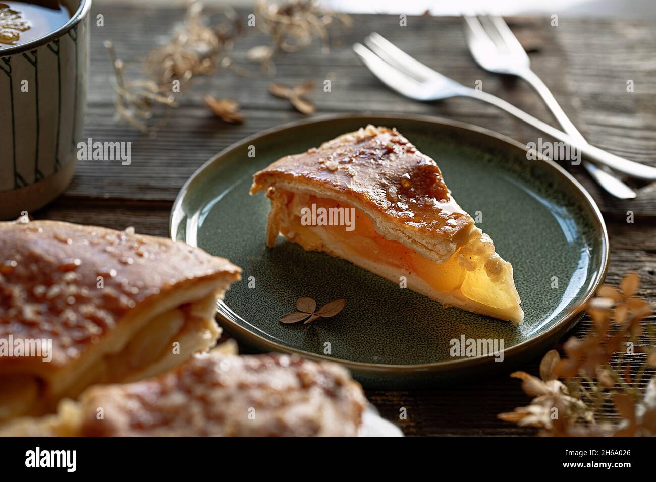 apple pie on breakfast table in sunshine Stock Photo