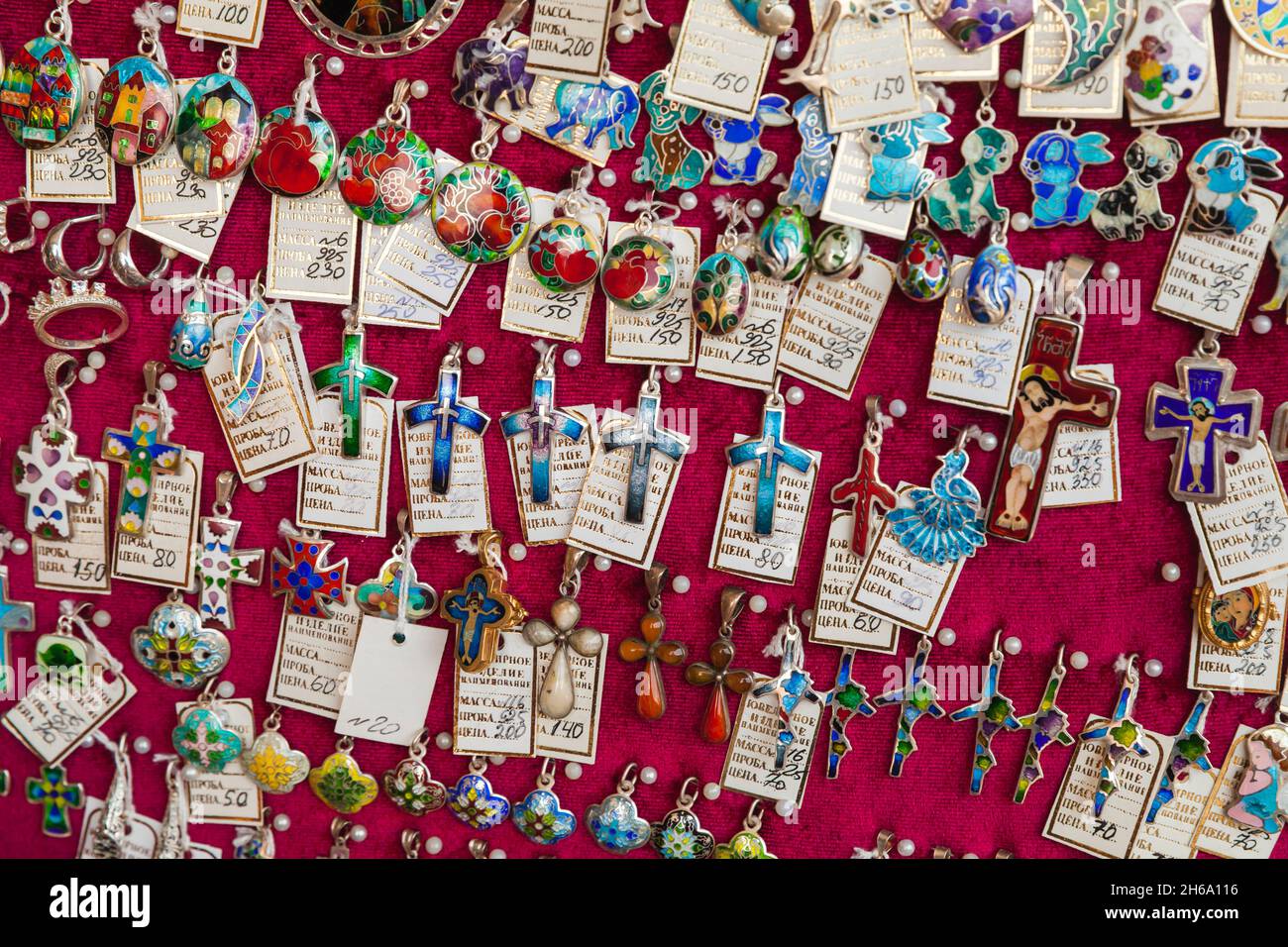 Tbilisi, Georgia - April 28, 2019: Handmade jewelry made by Minankari or cloisonne enamel is on a counter of a local gift shop. This jewelry technique Stock Photo