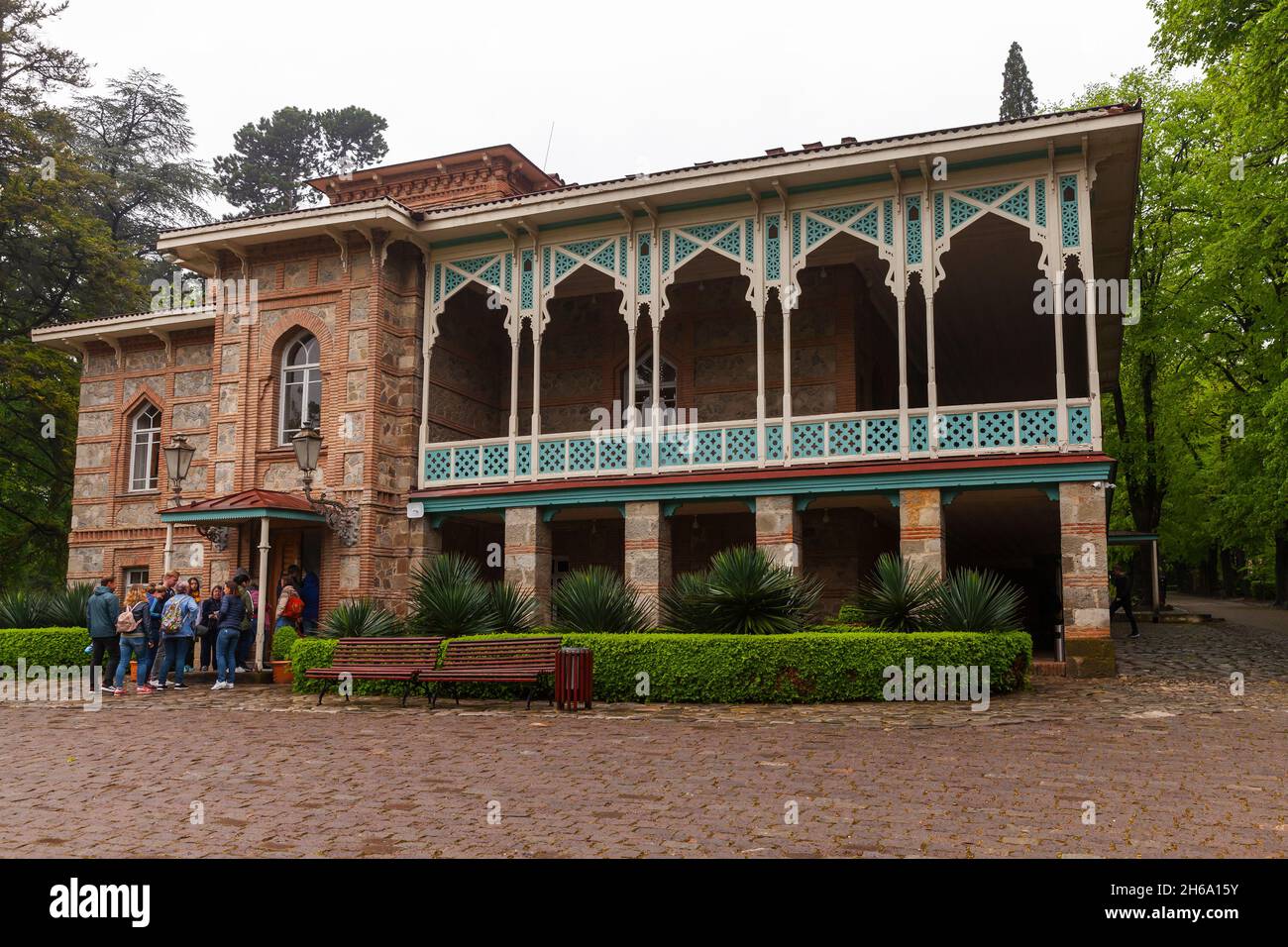 Tsinandali, Georgia - May 4, 2019: Tourists are at the entrance of the Tsinandali residence located a village in Kakheti, Georgia, situated in the dis Stock Photo