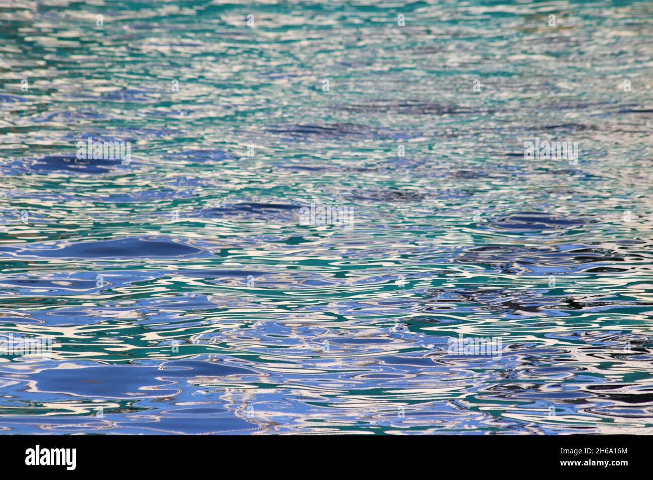 Patterns and colours in reflections of boats in harbour water Stock ...