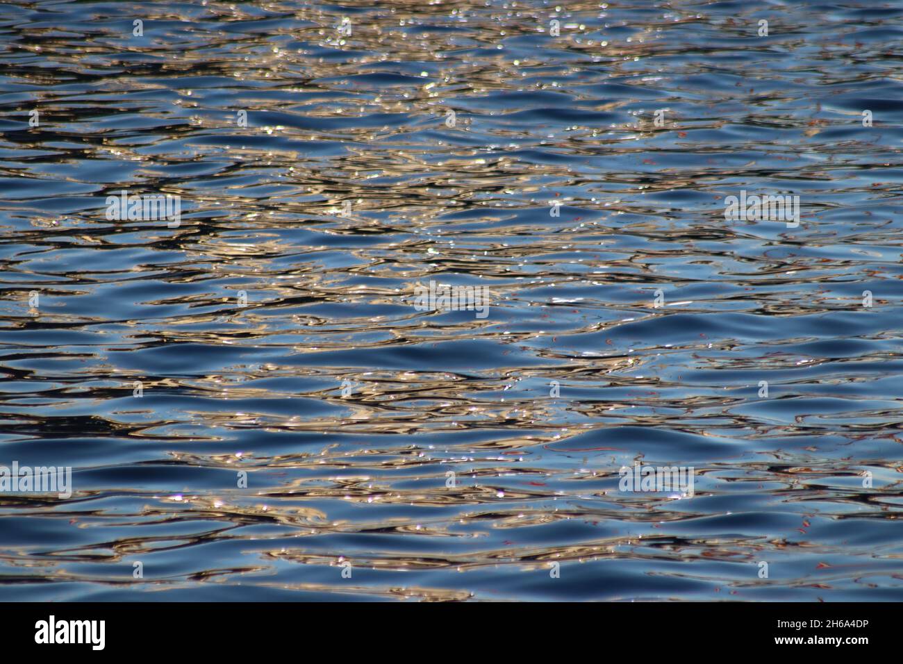 Abstract patterns and colours in reflections of fishing boats in ...