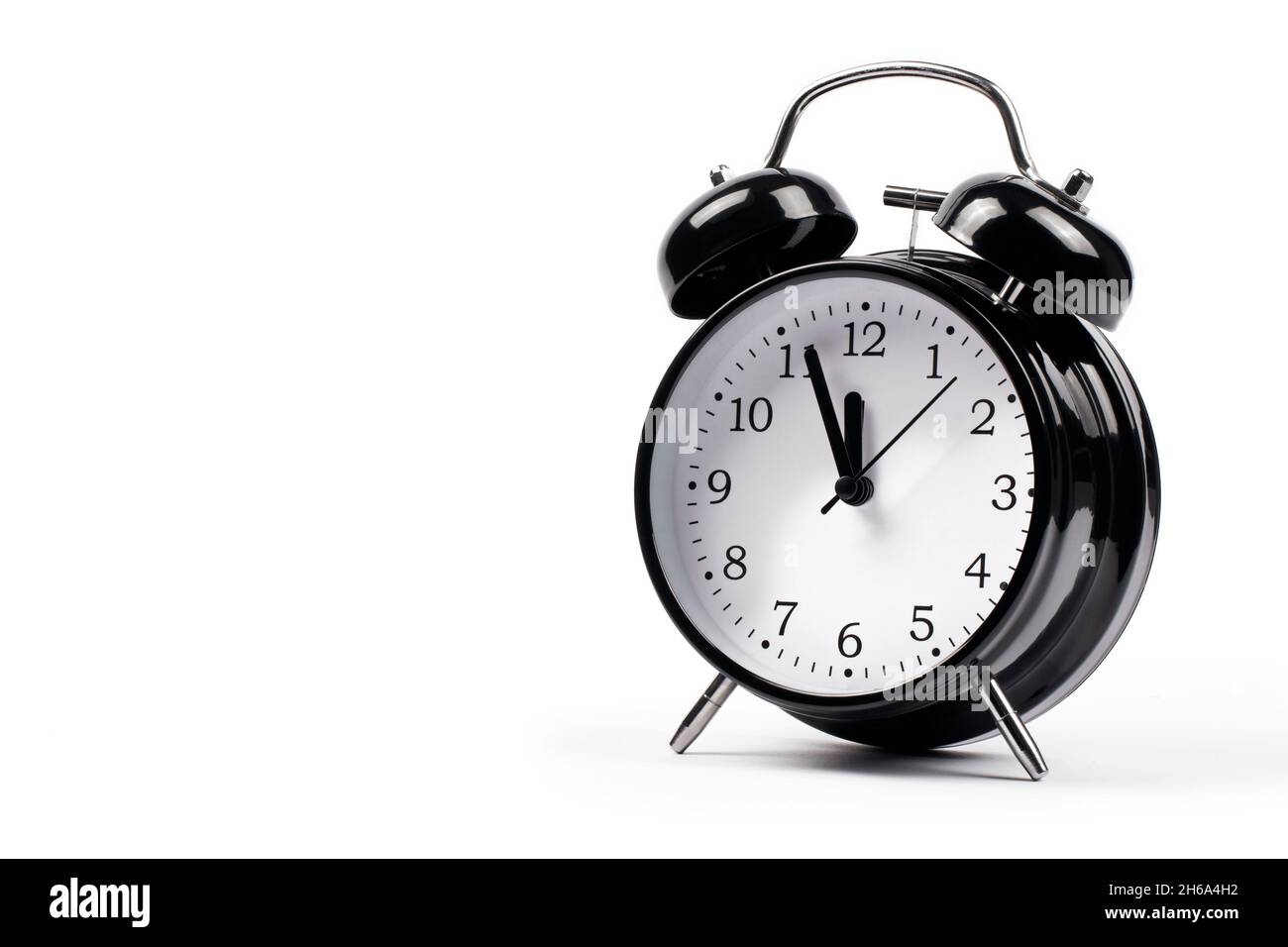 Black alarm clock isolated on white background Stock Photo - Alamy