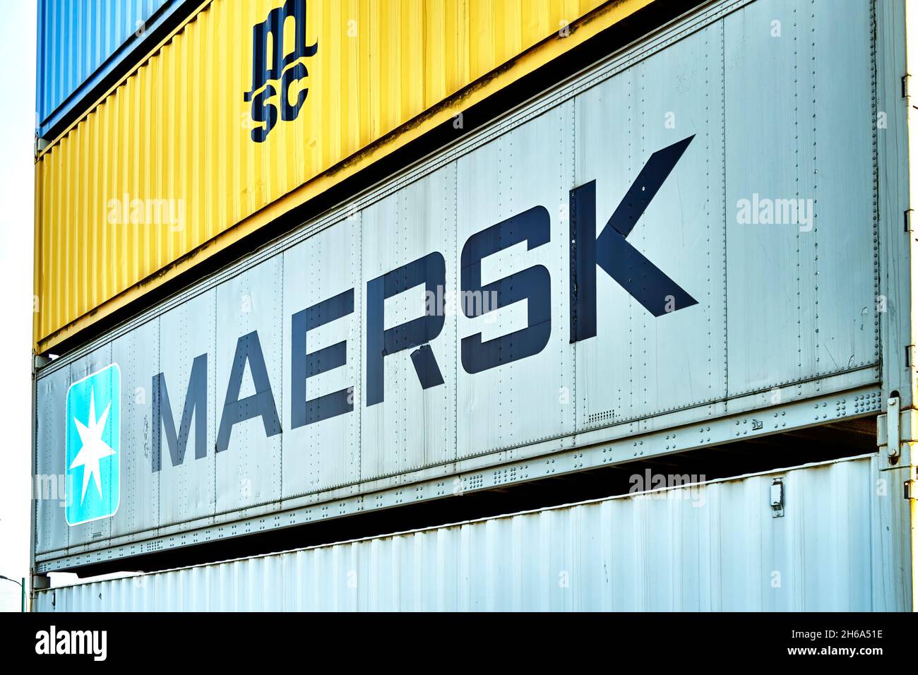 Maersk containers of the Danish container shipping company stacked with containers of the Swiss