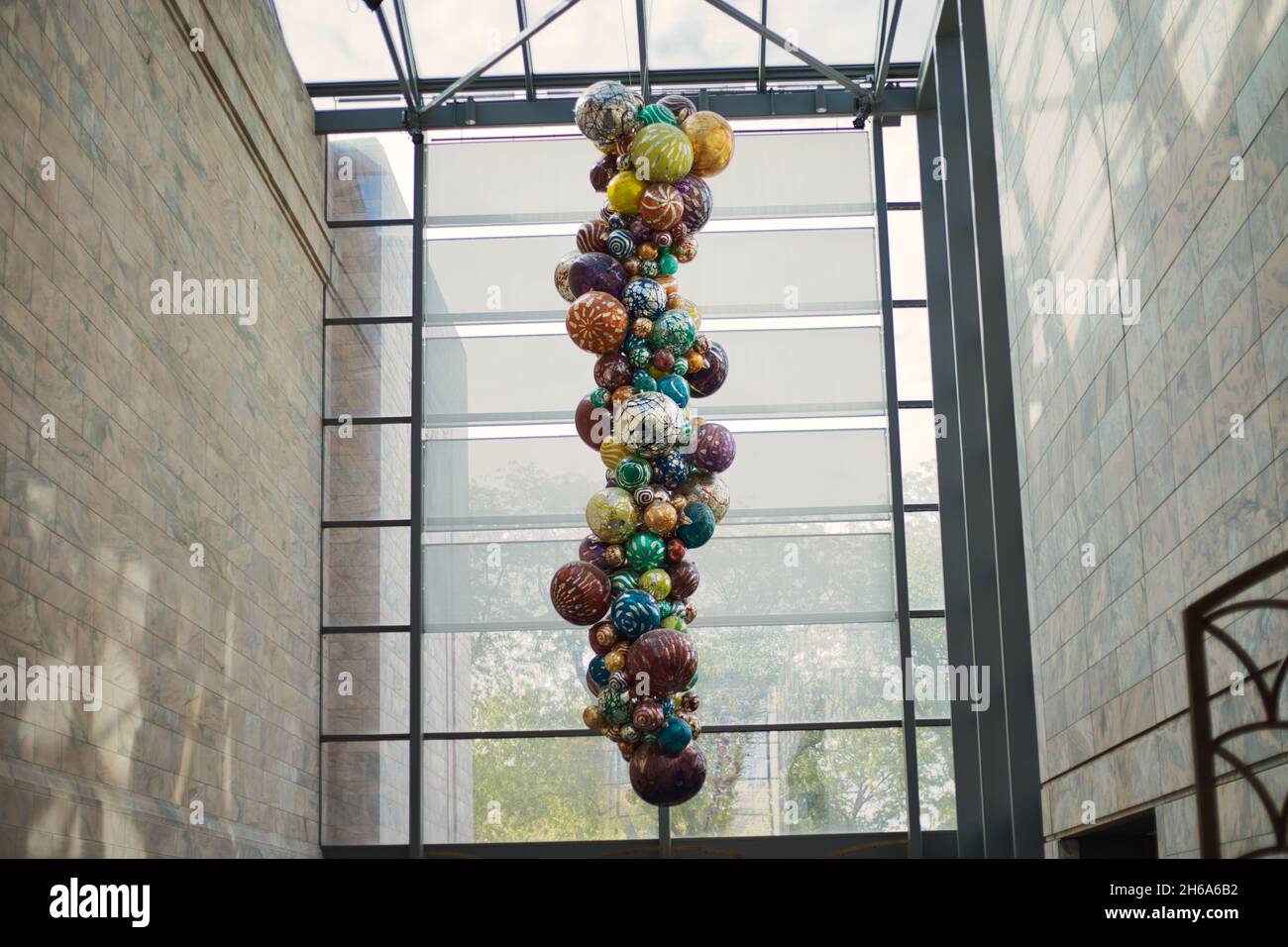 OMAHA, UNITED STATES - Oct 14, 2021: A piece of art with colorful balls hanging from the ceiling in Joslyn Art Museum, Omaha, Nebraska, USA Stock Photo