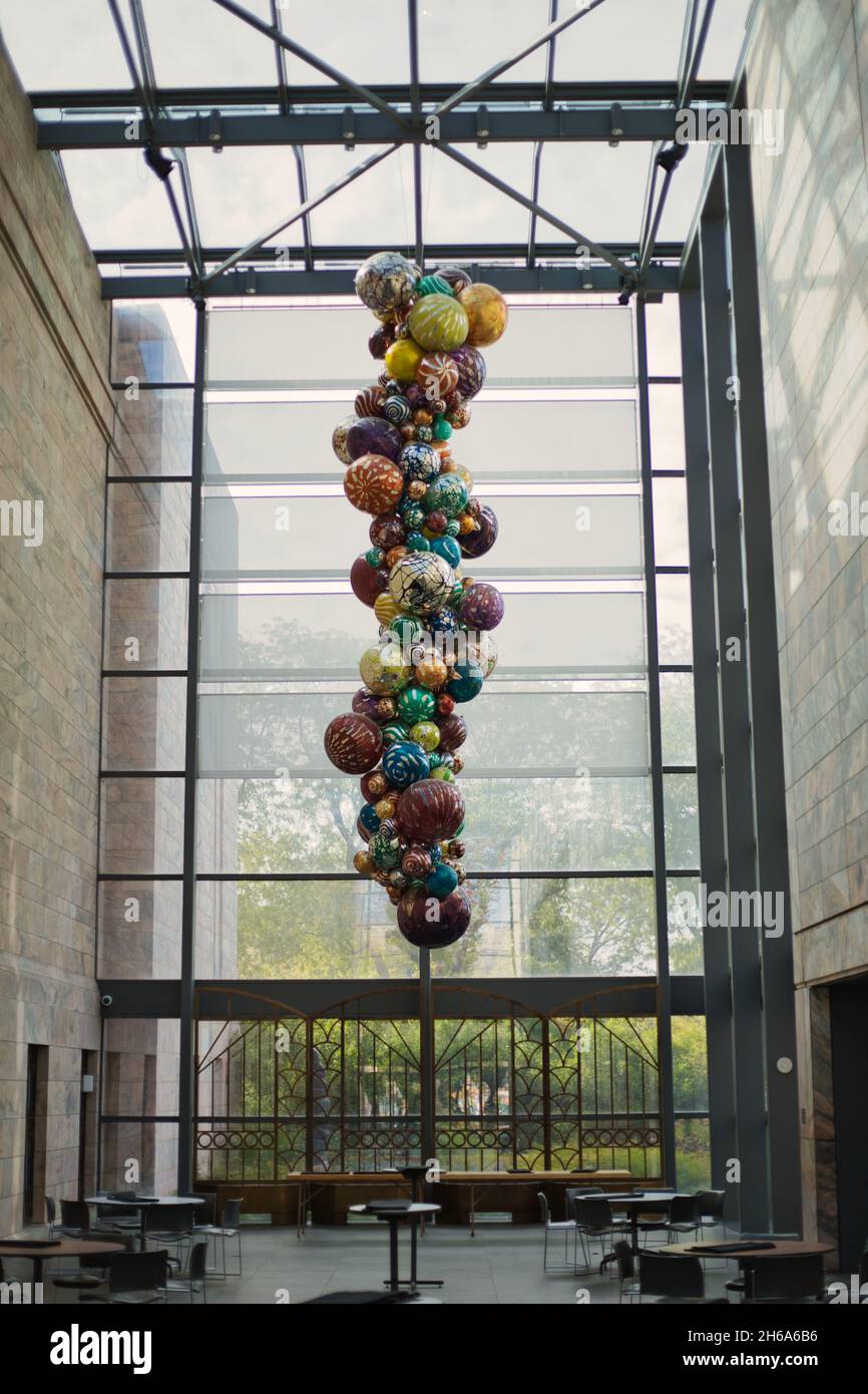 OMAHA, UNITED STATES - Oct 14, 2021: A piece of art with colorful balls hanging from the ceiling in Joslyn Art Museum, Omaha, Nebraska, USA Stock Photo