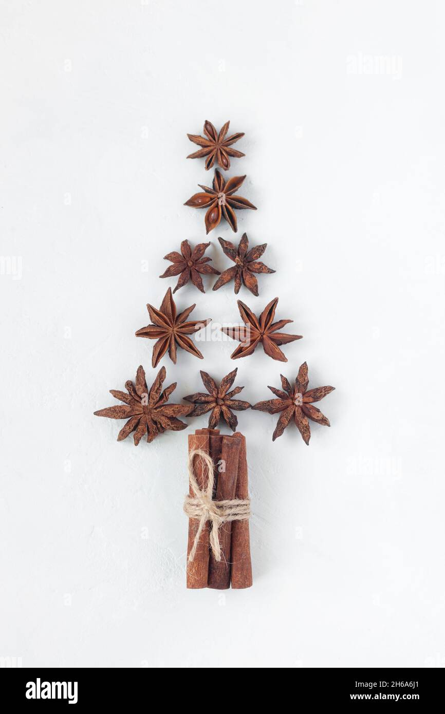new year tree made of stars anise and cinnamon sticks, white background, top view Stock Photo