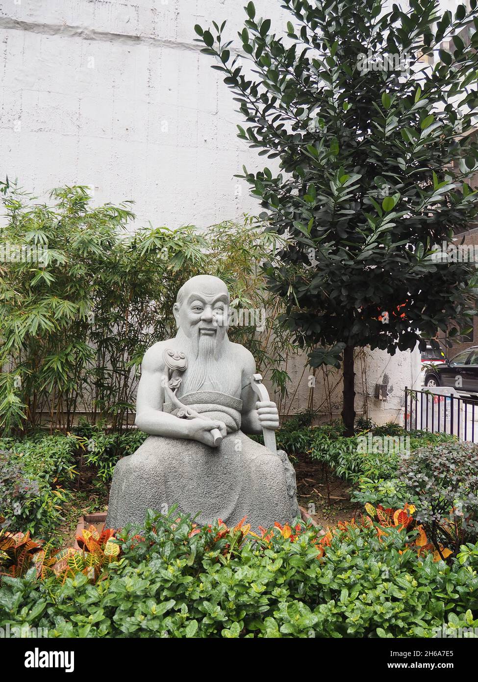 HONG KONG, CHINA - Oct 12, 2018: A beautiful shot of a statue of an old wise Chinese man in Hong Kong, China Stock Photo