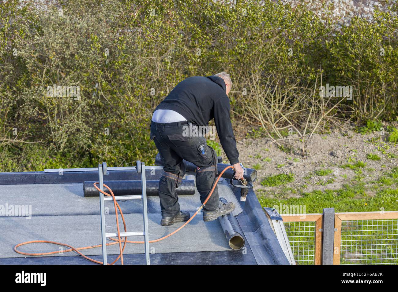 Installing roofing felt heating melting hires stock photography and