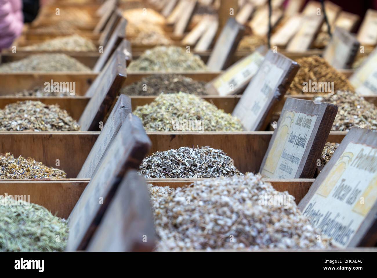 rows of boxes with spices at the fair, selective focus Stock Photo