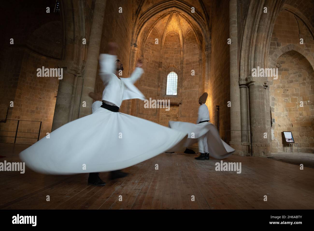 Group of Dervishes performing the traditional and religious whirling dance or Sufi whirling Stock Photo