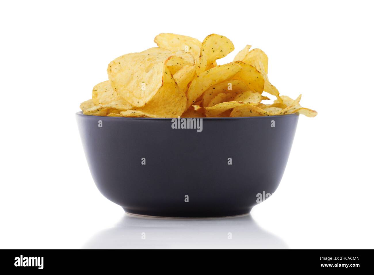 Potato chips in black ceramic cup isolated on white Stock Photo