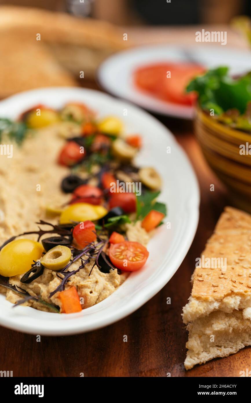 Home made hummus with flat bread. Stock Photo