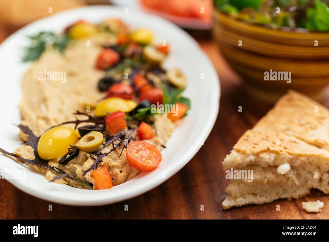 Home made hummus with flat bread. Stock Photo