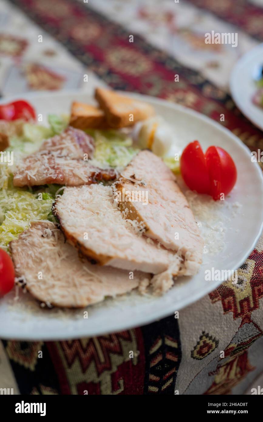 Caesar salad dish with chicken and lettuce Stock Photo
