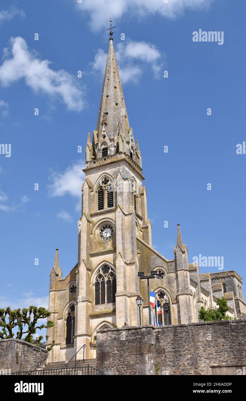 The late C 19th Gothiv-revival church of St Martial, which dominates the eastern half of the town of Montmorillon, France Stock Photo