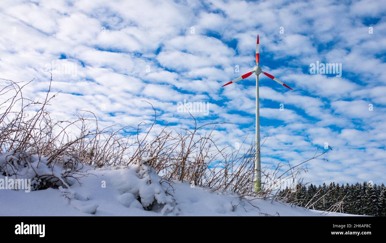 Wind power plant provides power even in snow, rain and sun and without CO2 emissions. Stock Photo