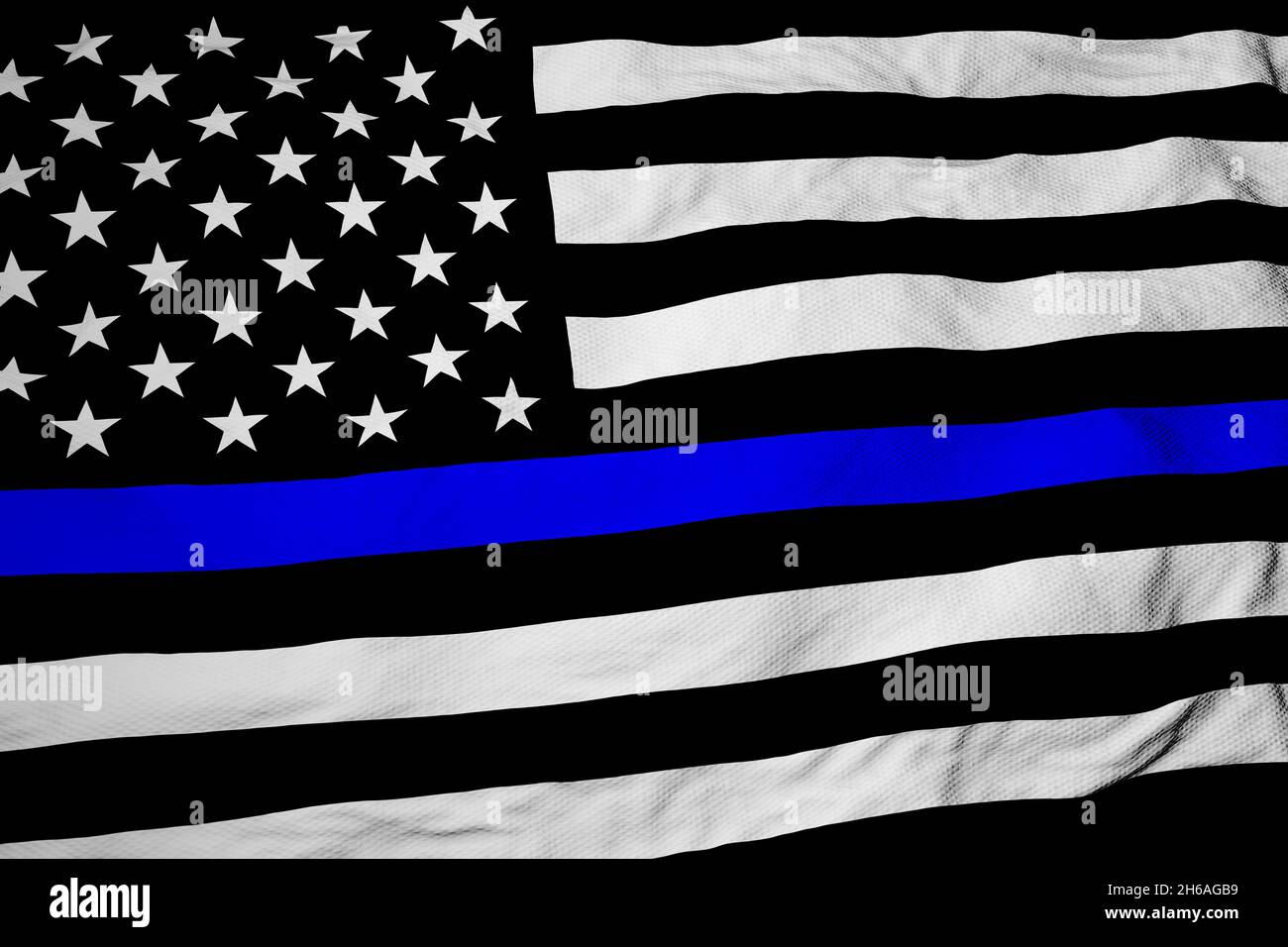 Full frame close-up on a waving black and white American flag with a blue stripe in 3D rendering. Stock Photo