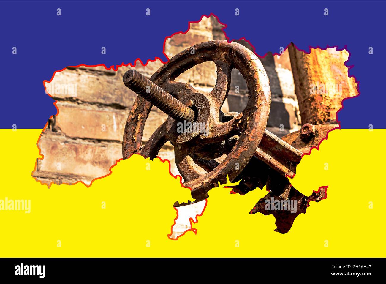 Old rusty gas control valve on the wall. Gas tap on a contour map on the flag of Ukraine. The gas transportation system of Ukraine is malfunctioning. Stock Photo