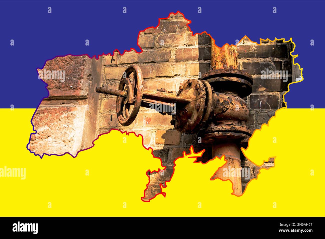 Old rusty gas control valve on the wall. Gas tap on a contour map on the flag of Ukraine. The gas transportation system of Ukraine is malfunctioning. Stock Photo