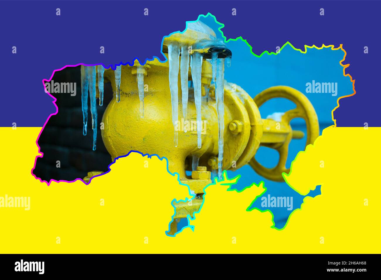 Winter. The yellow gas valve is covered with ice and icicles. Gas tap on a contour map on the flag of Ukraine. The gas transportation system of Ukrain Stock Photo