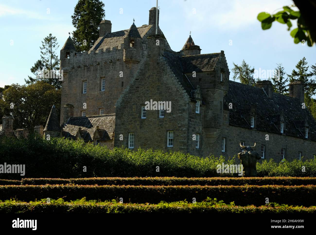 A colour photograph of Cawdor Castle situated close to Nairn in the Scottish Highlands.  The maze and minotaur can be seen to the fore. Stock Photo